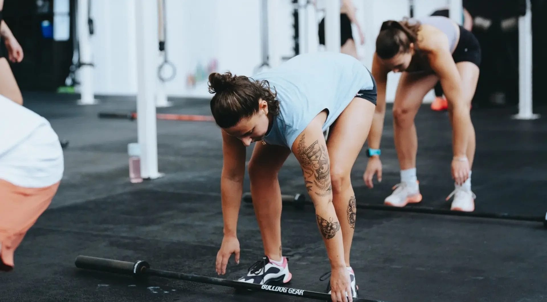women taking a lifting class